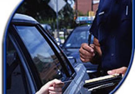 Handing a ticket to a driver