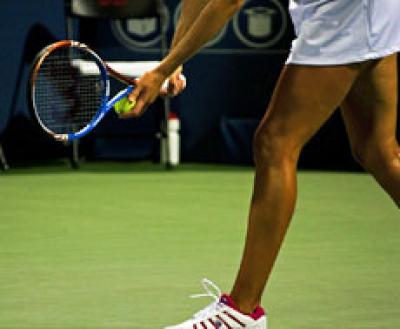 Tennis player readying serve